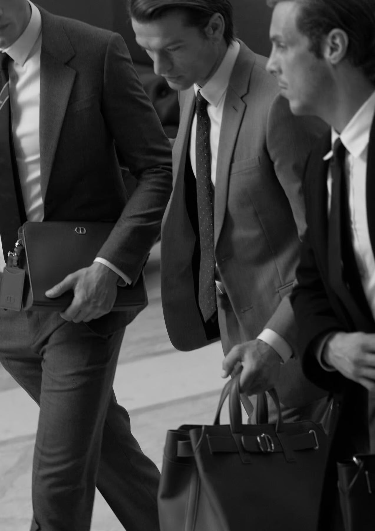 Two men in tailoring, photographed in black and white